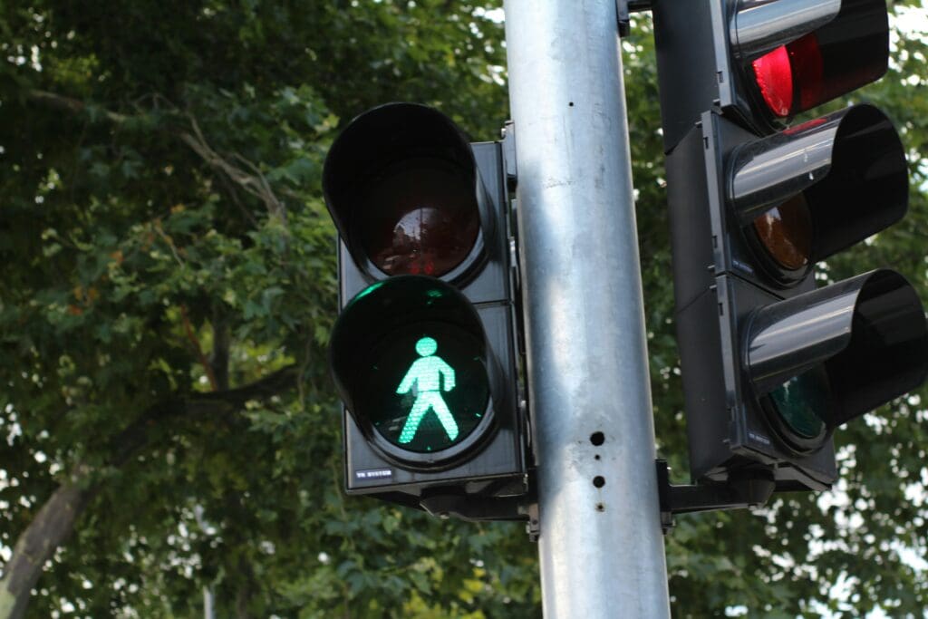 Traffic light showing a green man for pedestrians to walk
