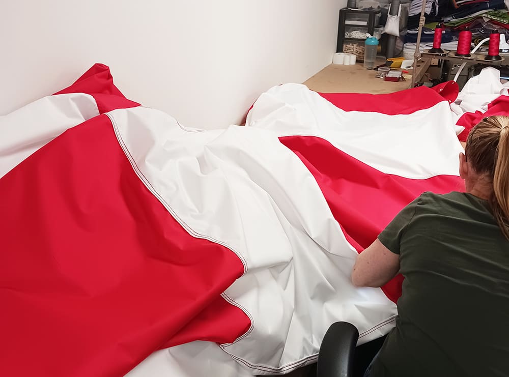 Red and white windsocks being made at our facility in the North East